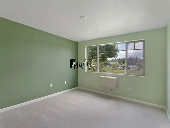Freshly painted green walls, demonstrating the quality of a wall painting Dubai service.